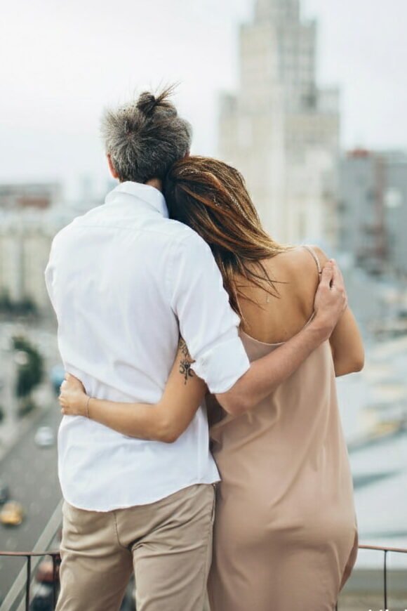 A happy couple manifesting a deep soulmate connection through the consistent use of the 369 manifestation method for love.