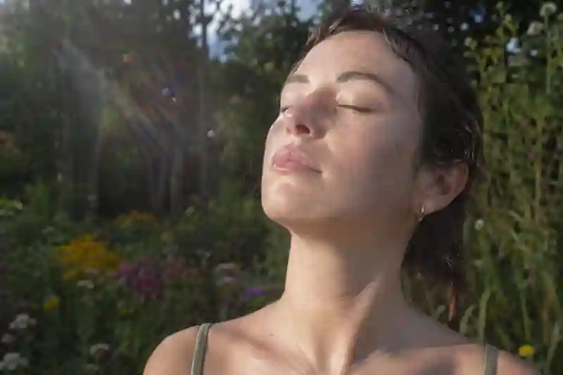A soft-focus candid of a woman smiling to herself, showing signs of alignment with the 777 manifestation method for love.
