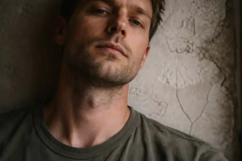Unprocessed sensor photo of a person with visible neck lines and skin texture, showing subconscious protection blocking love manifestation