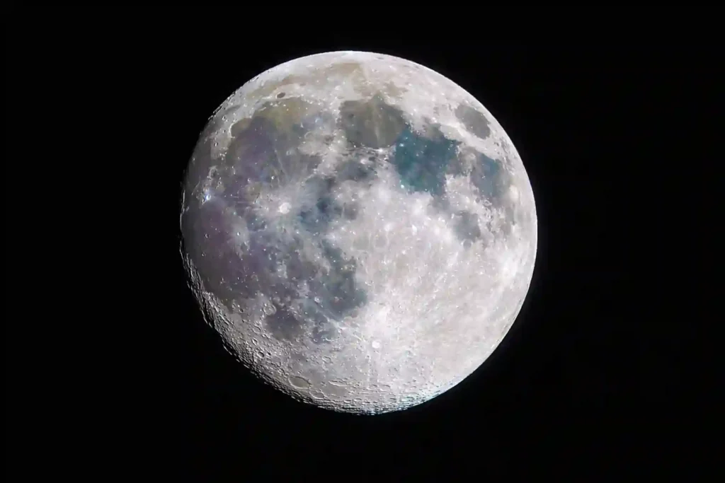 A raw, detailed astronomical photograph of the lunar surface with unusual mineral colors and deep craters, symbolizing frequency friction and nervous system mismatch.